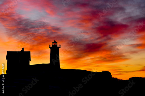 Early Maine Sunrise lights up the sky behind the Cape Neddick Lighthouse