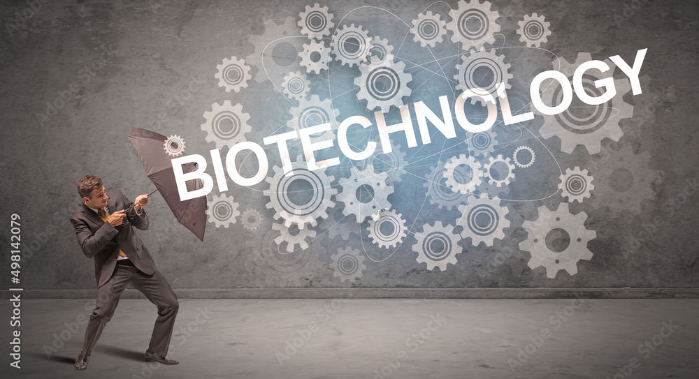 Fototapeta premium Businessman defending with umbrella concept