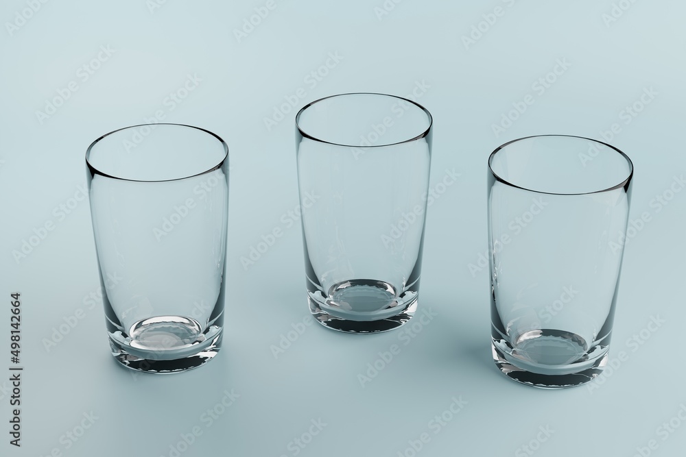 Three empty glass beakers on a blue background. Three empty glass beakers on a blue background.