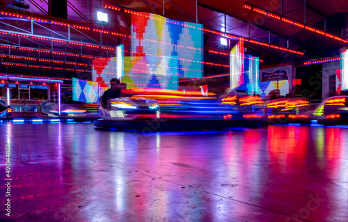 Bumper cars lights at Lincolnshire fair. Long exposure and night photography. Colourful and motion blur from bumper cars lights.  photo