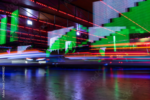 Lights and motion from bumper cars at the Lincolnshire fair. Leisure fairground rides. Lights and motion blur from recreational vehicles. Long exposure and night photography. © Carla Nascimento