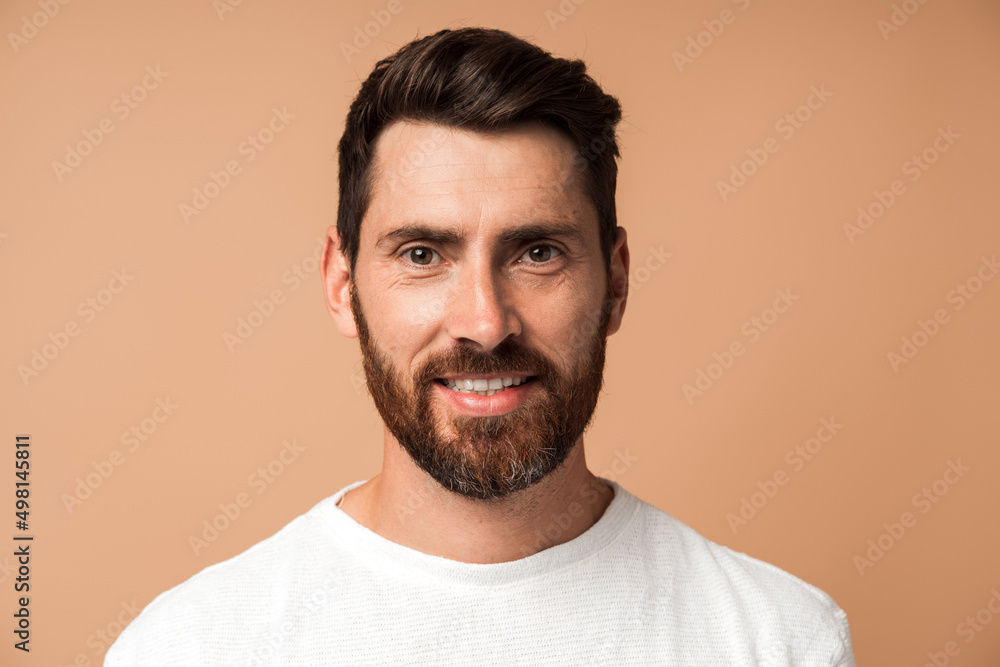 Handsome man in casual style looking at the camera and smiling while posing Handsome man in casual style looking at the camera and smiling while posing