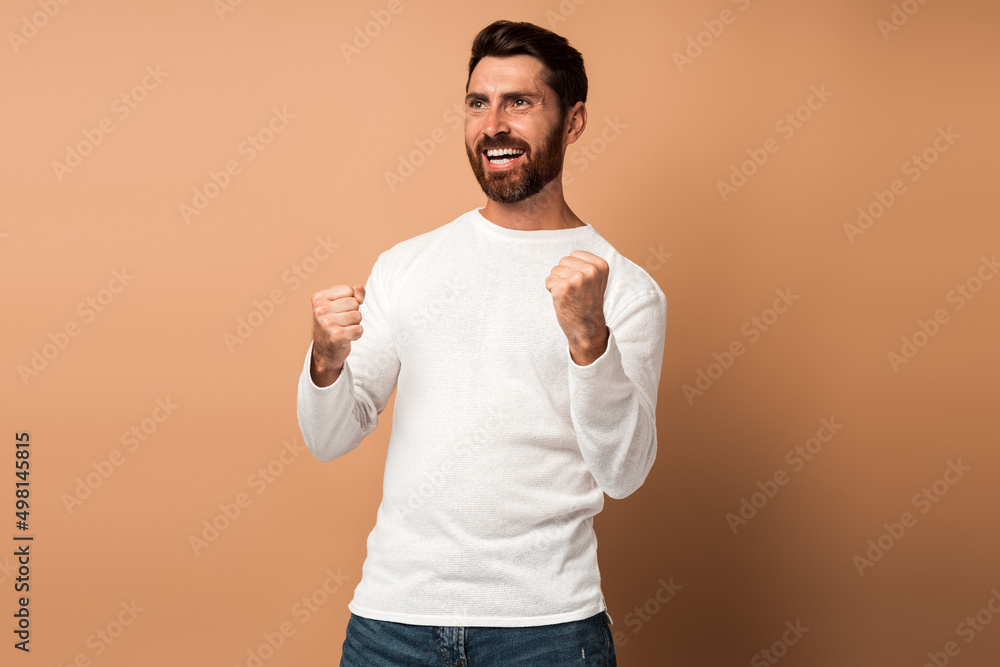 Ecstatic brunette man with beard showing yes i did it gesture Ecstatic brunette man with beard showing yes i did it gesture