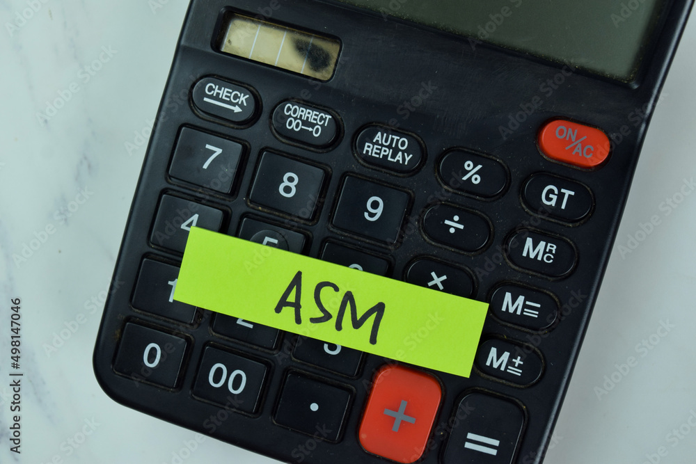 ASM and Calculator write on sticky notes isolated on Wooden Table. ASM and Calculator write on sticky notes isolated on Wooden Table.