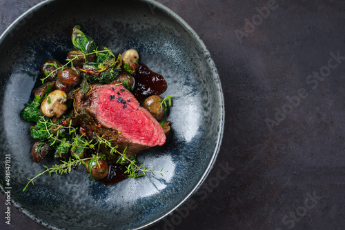 Schilderij op canvas Modern style traditional fried dry aged angus beef filet medaillons natural with