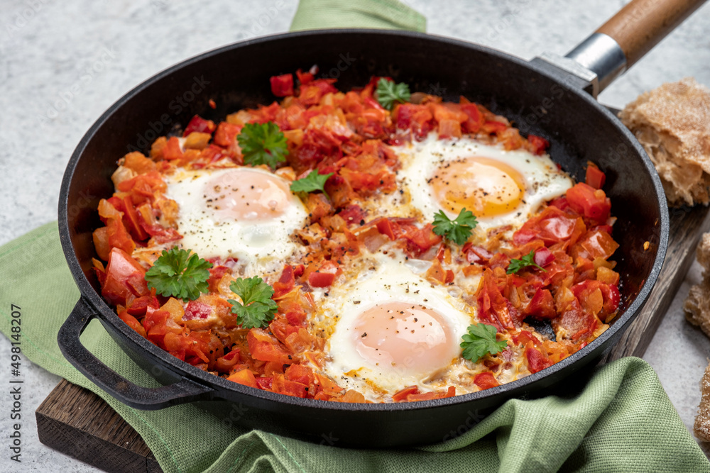 Shakshouka, eggs poached in sauce of tomatoes, Shakshouka, eggs poached in sauce of tomatoes,