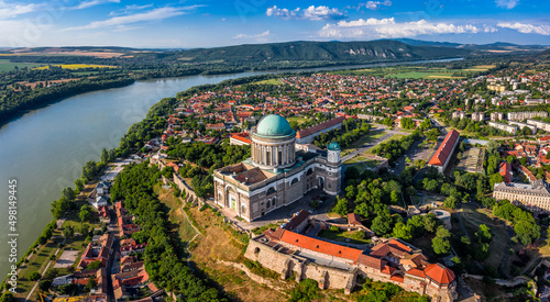 Esztergom, Hungary - Aerial panoramic view of Primatial Basilica of the Blessed Virgin Mary Assumed Into Heaven (Basilica of Esztergom) and city of Esztergom on a summer day with blue sky with clouds photo