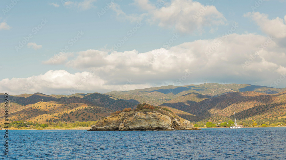 Panoramic view of small island with mountain at background