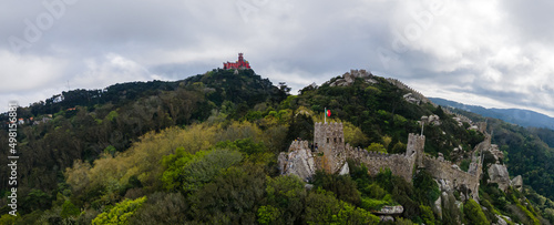 Castle of the Moors or Castelo dos Mouros is a hilltop medieval castle in Sintra town near Lisbon, Portugal. Aerial drone view. This castle is part of UNESCO World Heritage Site photo