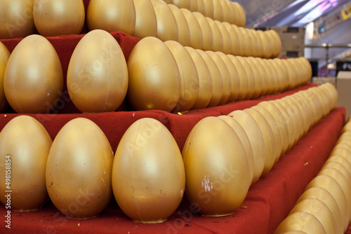 Golden eggs standing on the table