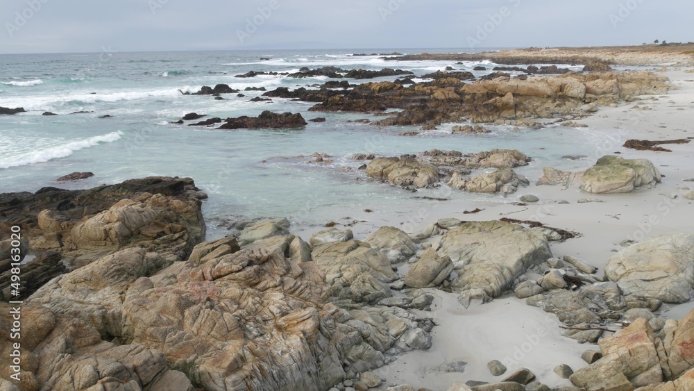 Rocky craggy pacific ocean coast, sea water waves crashing on rocks, 17-mile drive, Monterey, California USA. Gloomy nature near Point Lobos, Big Sur, Pebble beach. Dramatic cloudy rainy cold weather. Rocky craggy pacific ocean coast, sea water waves crashing on rocks, 17-mile drive, Monterey, California USA. Gloomy nature near Point Lobos, Big Sur, Pebble beach. Dramatic cloudy rainy cold weather.
