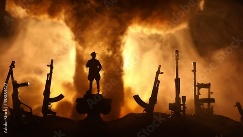Creative artwork decoration - Russian war in Ukraine concept. Road and giant weapons with giant explosion of nuclear bomb. Selective focus photo