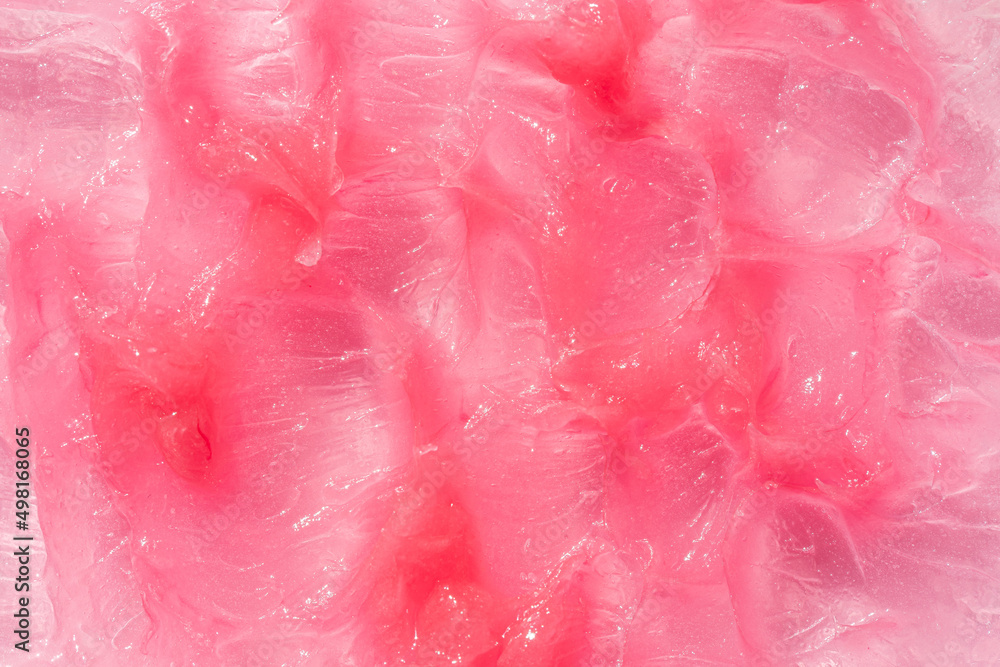 Fototapeta premium Moisturising and cleaning beauty product sample swatch. Cosmetic smear texture background. Pink creamy balm product closeup.