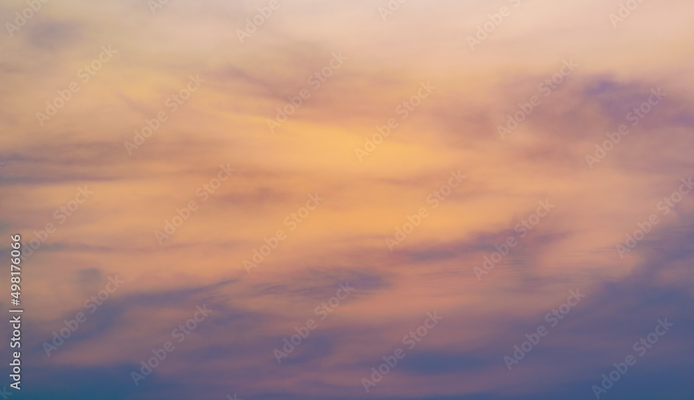 Colorful sky background with the orange and purple clouds, sunset at twilight. Nature abstract concept.
