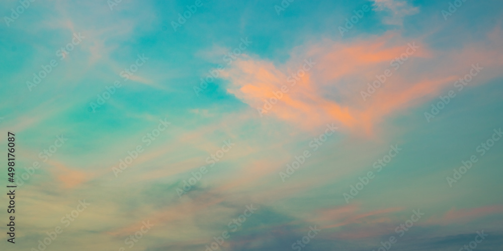 Obraz premium Colorful blue sky background with the orange cloud, sunset at twilight. Nature abstract concept.