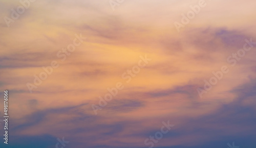 Fototapeta Naklejka Na Ścianę i Meble -  Colorful sky background with the orange and purple clouds, sunset at twilight. Nature abstract concept.