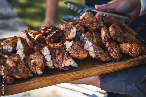 Freshly grilled sweetbreads served on wooden tray