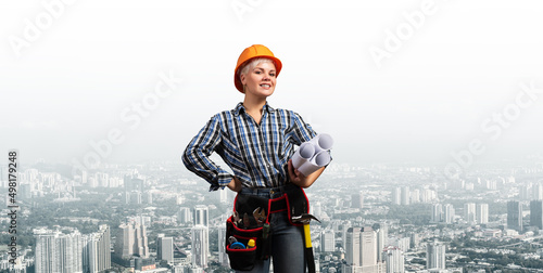 Attractive female engineer in hardhat