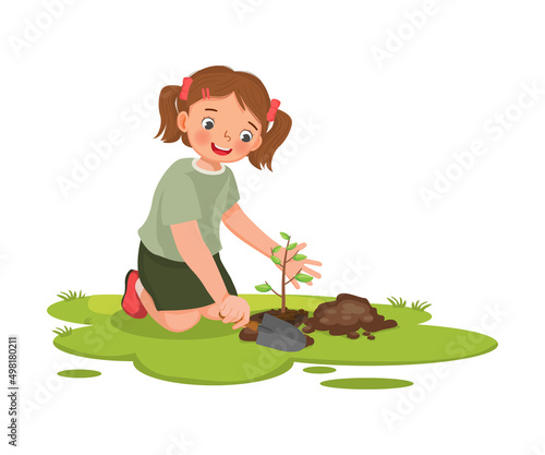 cute little girl with shovel planting young tree seedlings in the garden