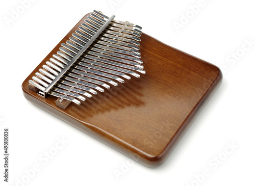Top view wooden african instrument Kalimba musical isolated on white background. play on hands and plucking the tines with the thumbs 