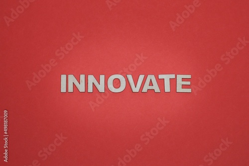 INNOVATE letterings isolated on the orange background