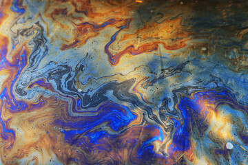 spilled gasoline rainbow background, industrial hazard spill pollution, abstract texture multicolored