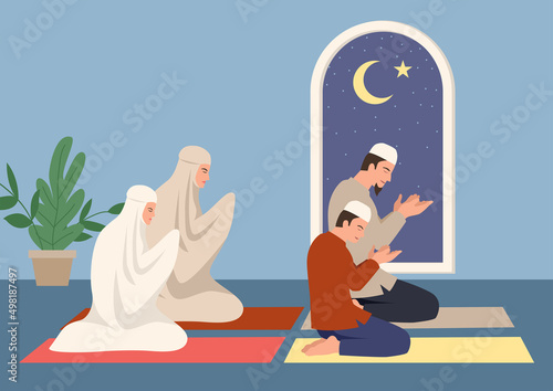 Muslim family praying together