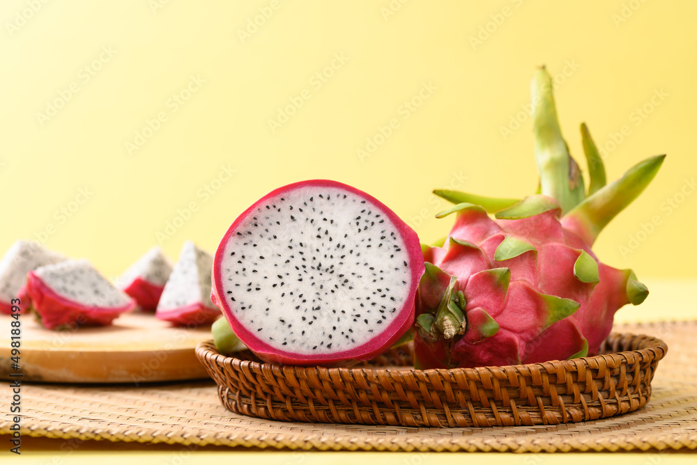 Fresh dragon fruit or pitaya in basket on yellow background, Tropical fruit Fresh dragon fruit or pitaya in basket on yellow background, Tropical fruit