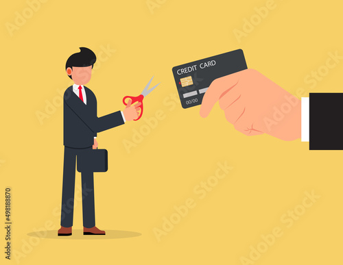 Credit card cutting. Businessman using scissors to cut credit card,destruction concept