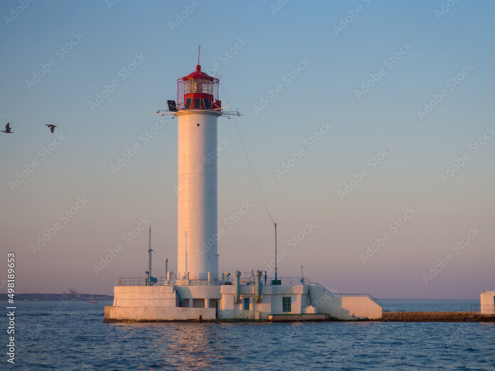 The Vorontsov Lighthouse in the Black Sea port of Odessa, Ukraine in the evening. The current lighthouse is the third to stand on the same spot. The first was built in 1862 and was made of wood. The Vorontsov Lighthouse in the Black Sea port of Odessa, Ukraine in the evening. The current lighthouse is the third to stand on the same spot. The first was built in 1862 and was made of wood.