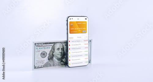 E banking concept. Mobile phone with internet online bank app. Pig bank with hundred dollar bill on white background. Online wallet save money.