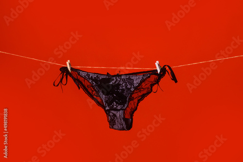 Fotografi Lace red panties on rope