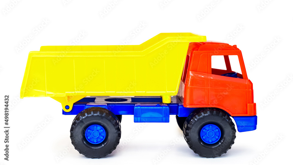 colorful plastic toy tipper dumper truck, isolated (global altered)