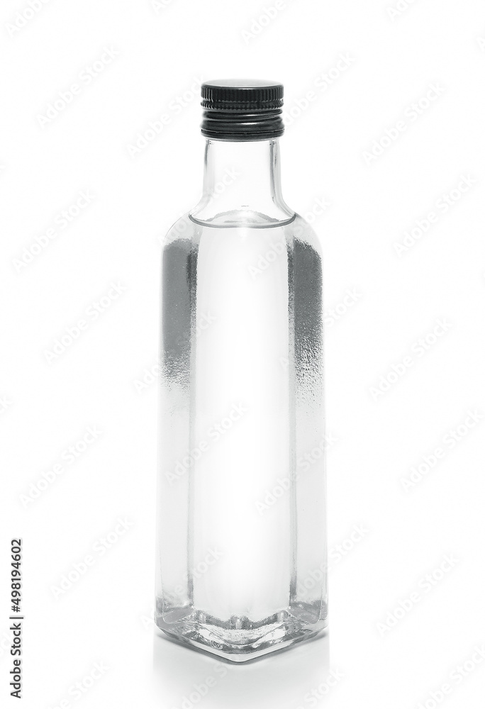 bottle of vodka or transparent drink, on white bottle of vodka or transparent drink, on white