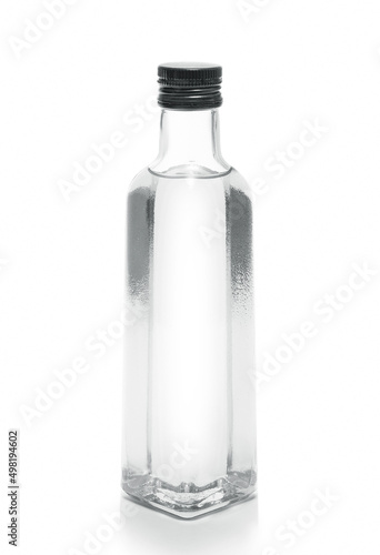 bottle of vodka or transparent drink, on white