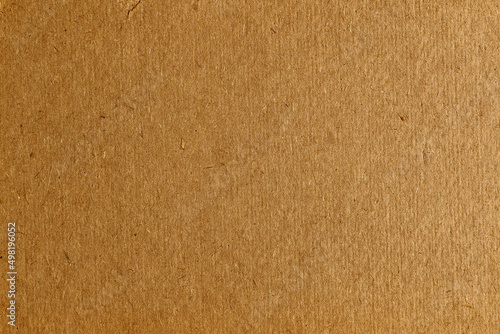 Brown cardboard background, flawed paper texture