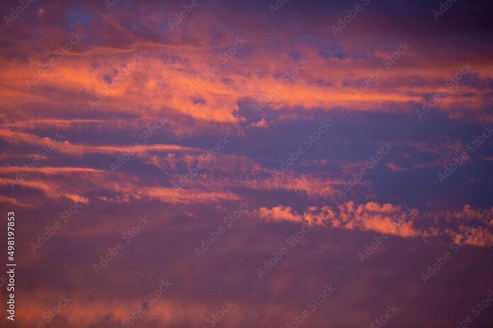 Dramatic and moody sunset sky with clouds