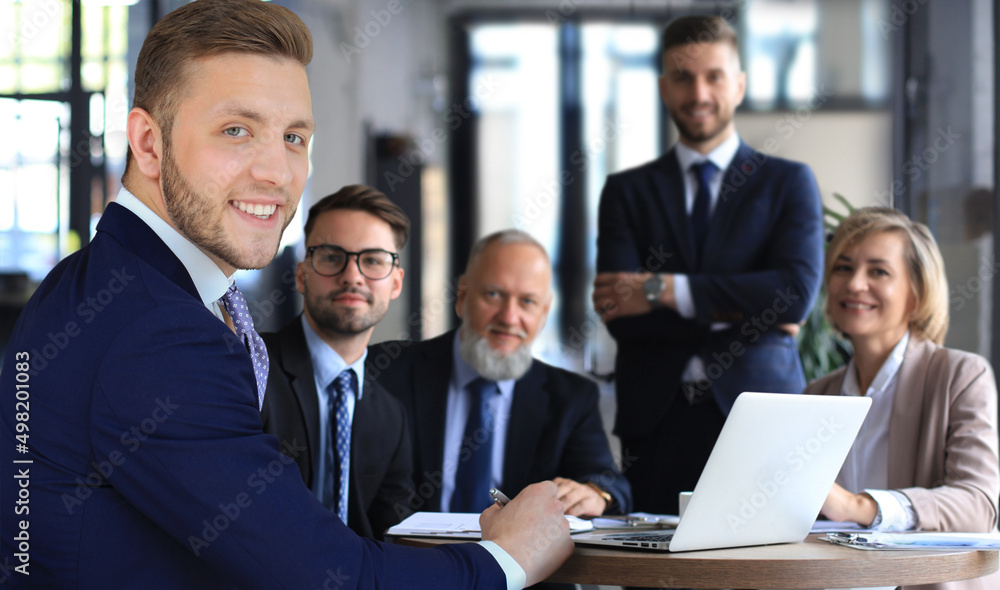 Portrait of a positive business employees at an office business meeting.