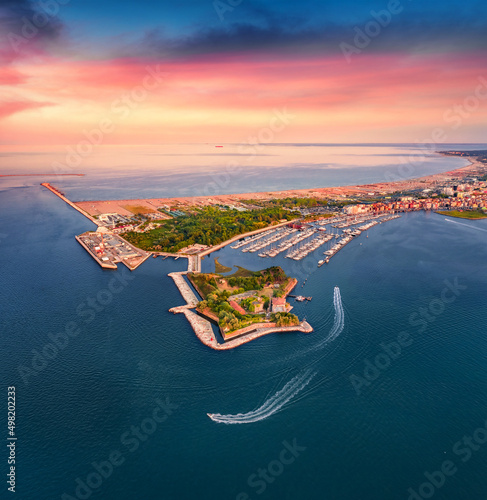 Stunning sunset on Adriatic sea. Astonishing summer view from flying drone of San Felice fortress, Italy, Europe. Traveling concept background. photo