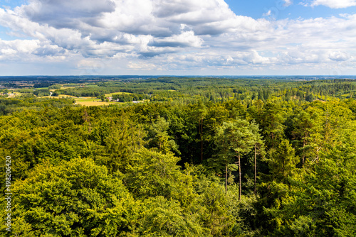 Panorama of summer forest hills and lake valleys of Kashubian landscape park seen from Wiezyca hill observation tower near Szymbark town in Pomerania region of Poland