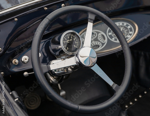 steering wheel of a vintage left hand drive car  © Robert L Parker