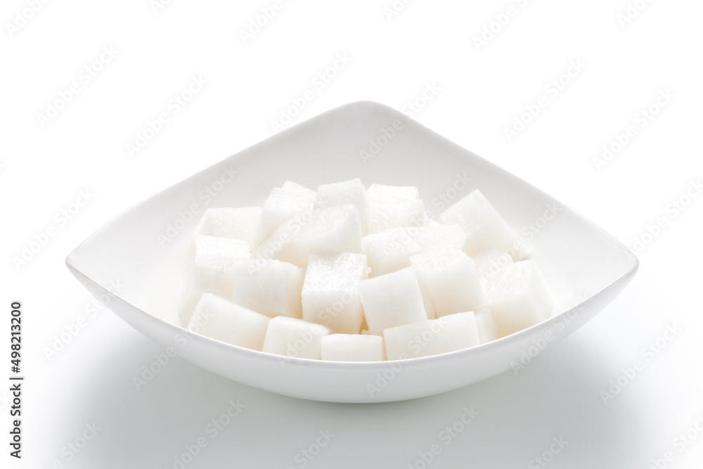 Chopped white radish in a plate isolated on white background Chopped white radish in a plate isolated on white background