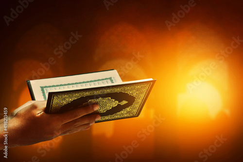 Muslim man reading holy quran photo