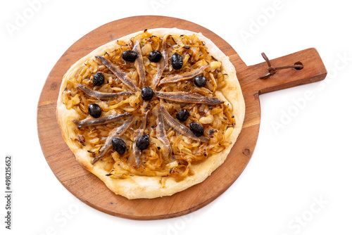 cooked pissaladière on a wooden board isolated on a white background photo