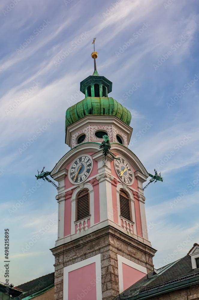 Tower of Hospital Church of the Holy Spirit against picturesque sky, Innsbruck, Austria