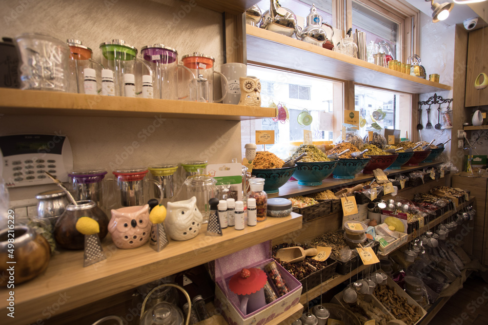 Spices, grains, and ornaments for sale at the market 