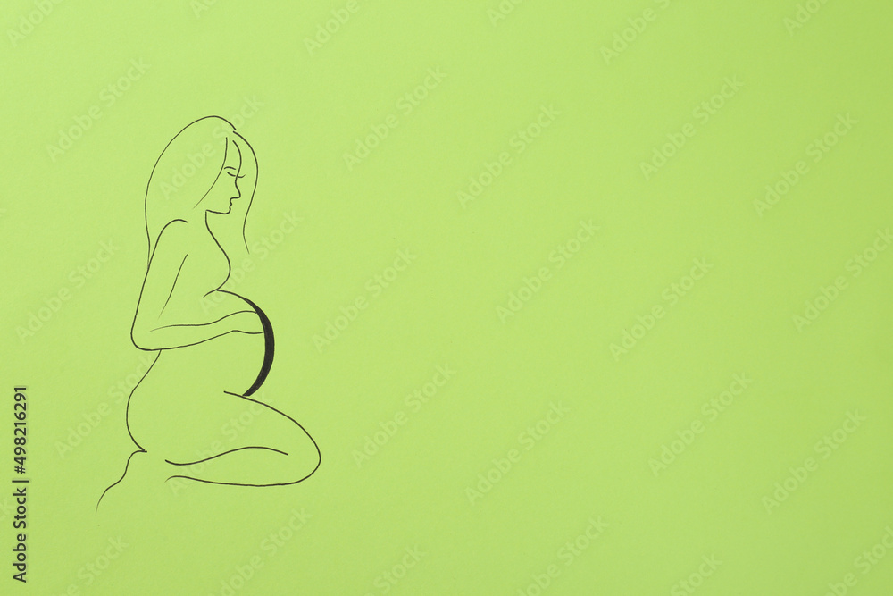 Pregnant woman figure drawn on light green background, top view with space for text. Surrogacy concept Pregnant woman figure drawn on light green background, top view with space for text. Surrogacy concept