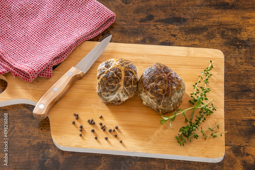 top view of raw caillette on wooden board photo