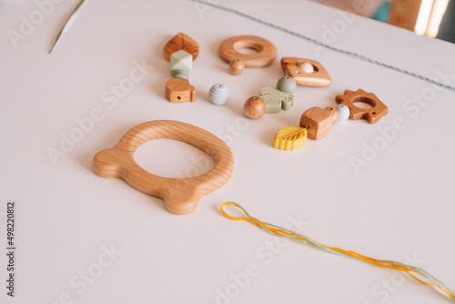 Φωτογραφία Natural safe accessories of wood on desk, eco style pacifiers