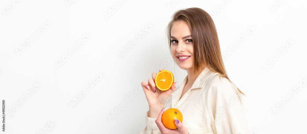 Young Caucasian smiling woman with slices orange over isolated white background Young Caucasian smiling woman with slices orange over isolated white background
